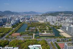 View of Hiroshima cityscape with Hiroshima Memorial Peace Park and Hiroshima Castle from a hotel rooftop