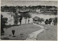 View across Sarawak river from Astana tower in 1959 showing Kuching waterfront and Square Tower