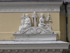 Theology and justice relief sculptures on the facade of the National Library of Finland