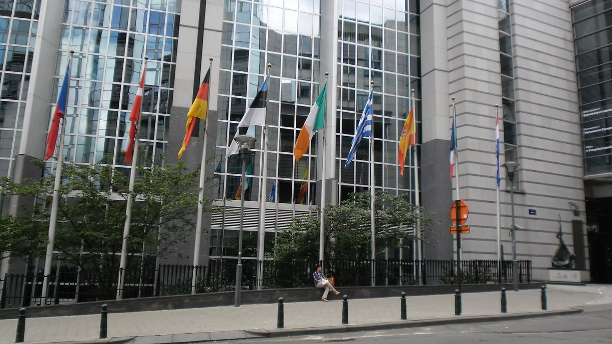 Modern architectural building with symmetrical design and large glass windows