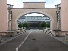 View of the old entrance of Les Abattoirs de la Mouche with Halle Tony Garnier in the background in Lyon 7th arrondissement