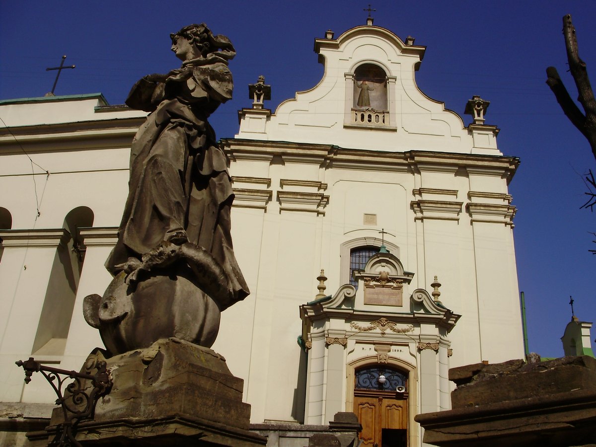 Bell tower and sculptures of the front staircase of St. Anthony's Church in Lviv