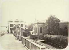 Front view of Kriukovo railway station building with trains on tracks