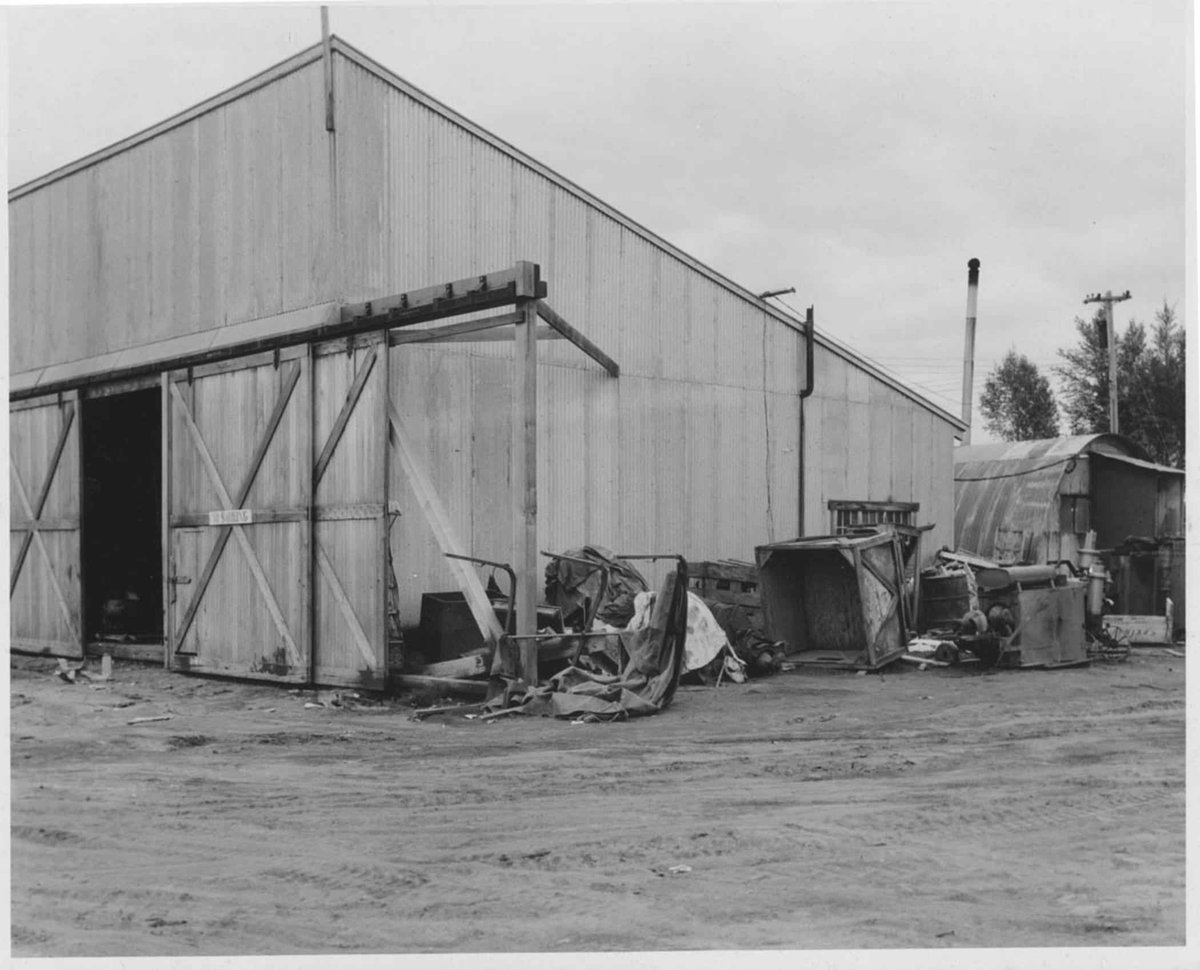 Airplane hangar at Lake Hood in Anchorage with seaplanes and snowy surroundings