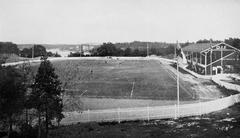 General view of the Traneberg athletic grounds in Stockholm in 1912 with open sports fields and surrounding houses