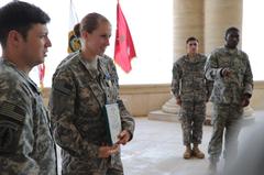 U.S. Army Spc. Abbie Pierce giving a speech after receiving medal and certificate at award ceremony in Al Faw Palace, Camp Victory, Iraq