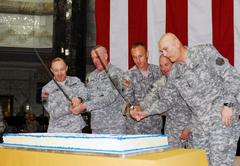 U.S. Army generals and sergeants cutting cake to celebrate Army's 234th birthday at Al-Faw Palace in Baghdad