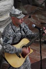 Staff Sgt. Chandler Lockert performing song at Army National Guard’s 372nd Birthday Ceremony in Baghdad Iraq