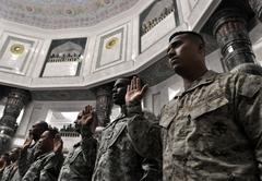 U.S. troops taking Oath of Citizenship during naturalization ceremony in Baghdad