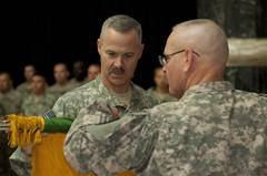 Brig. Gen. Donald Currier and Command Sgt. Maj. Robert Liles casing the 49th Military Police Brigade colors during end-of-mission ceremony at Al Faw Palace rotunda Camp Victory Baghdad