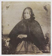 Portrait of Jemima Stroud standing with folded hands