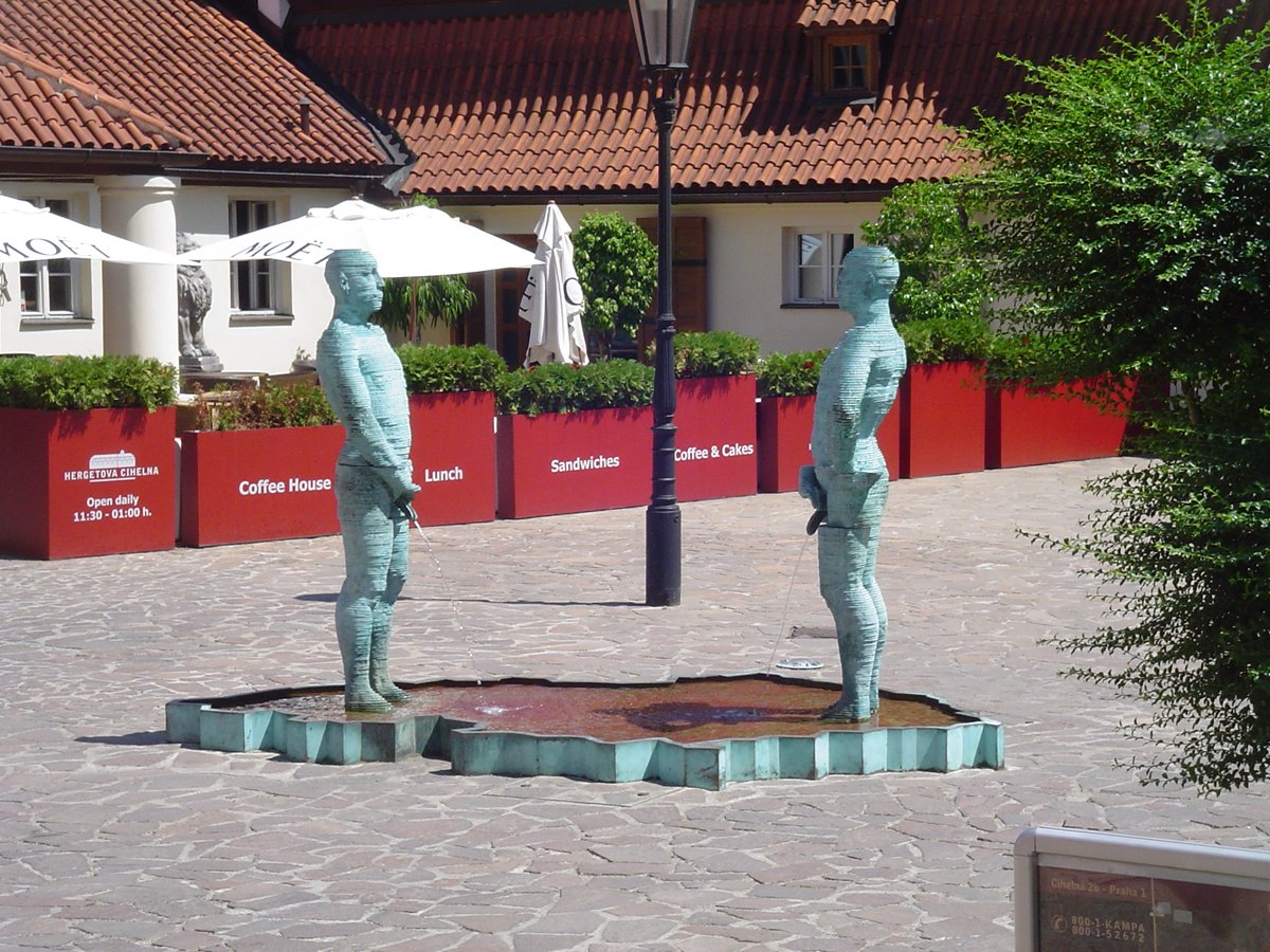 David Černý statues outside the Franz Kafka Museum on Cihelna Street in Mala Strana, Prague