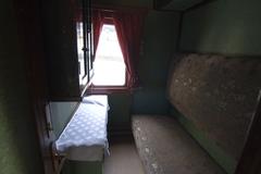 Interior of a historical train carriage at a railway rolling stock exhibition in Kyiv
