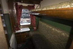 Interior of a historical train carriage at a railway exhibition in Kyiv