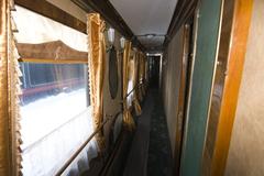Interior of a historical train carriage with vintage seats and decor