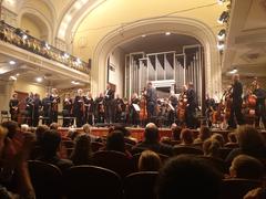 Lithuanian National Philharmonic Orchestra performing in concert hall