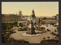 The Place Iljinka in Moscow, Russia with historic buildings along the street and cars parked