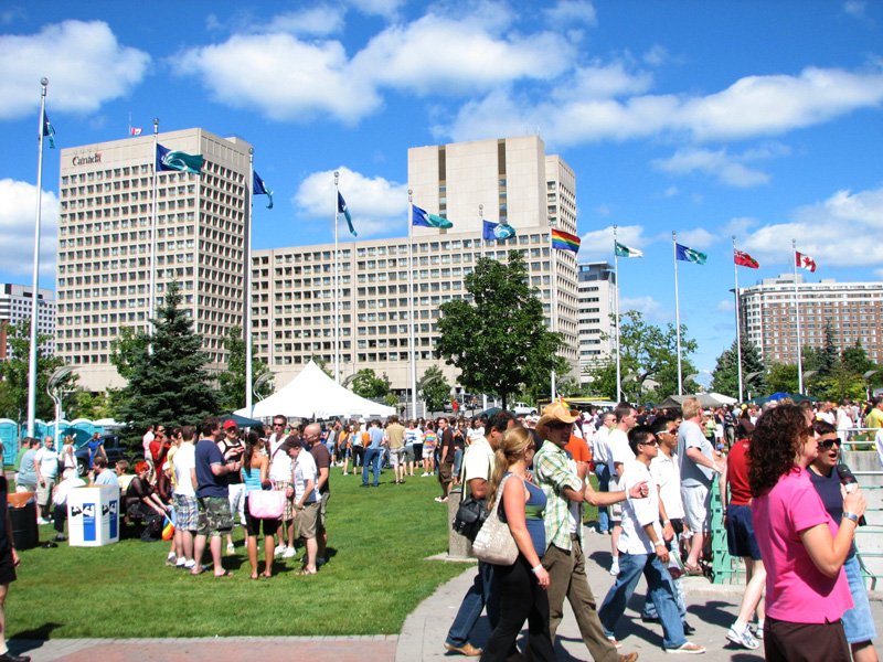 Colorful parade with performers and spectators along city street