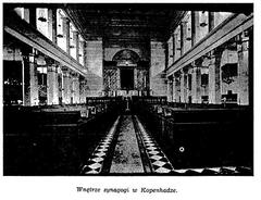 Interior of the Synagogue in Copenhagen with ornate ceiling and chandelier
