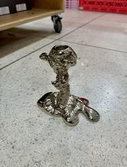 Aluminium drip candle holder designed by Pascal Smelik for Polspotten, displayed in Helsinki store