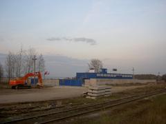 Construction site preparations for Lomonosov port with machinery and workers