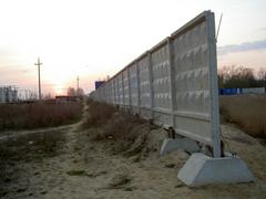 Preparation work for port construction in Lomonosov with construction equipment and cleared land