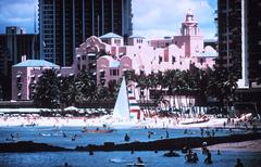 Waikiki Beach with Royal Hawaiian Hotel in the background during sunset in December 1969