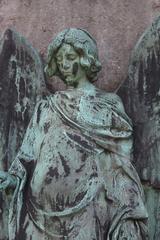 Historic Alter Südfriedhof cemetery in Munich with old gravestones and lush green trees