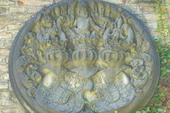Relief sculpture on the cemetery wall at Alter Südfriedhof in Munich