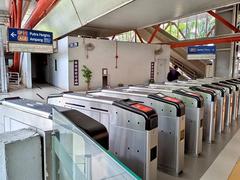 Interior of PWTC LRT station concourse in Kuala Lumpur with escalators and information displays