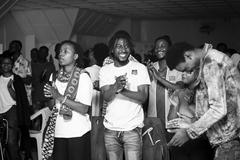 Young audience enjoying the theatre show Tant qu'on s'aime at the Institut Français in Goma