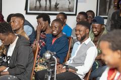 Youth enjoying the theatrical performance 'Tant qu'on s'aime' at Institut Français in Goma