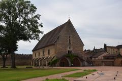 Abbaye de Cluny historic abbey ruins under partly cloudy sky