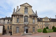 View of Abbaye de Cluny historic monastery ruins surrounded by green landscape