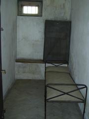 Isolation cell in Gestapo prison with iron fetters on floor