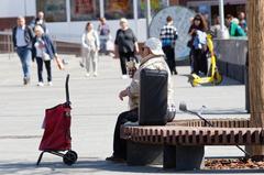People walking and standing in a busy street area in Taganka, Moscow