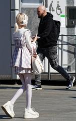 People walking and socializing at Taganka Square in Moscow during springtime