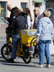 People walking on a street in Taganka, Moscow in April 2025
