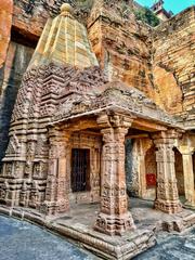 Chaturbhuj Temple carved into Gwalior Fort rock face with inscriptions and Hindu deity reliefs