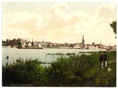 Rhine riverside front of Düsseldorf's Old Town during the beginning construction of Oberkasseler Bridge around 1896