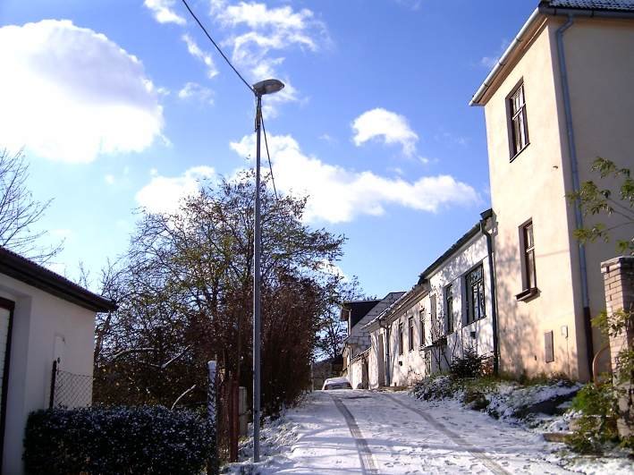 Street view of Ruský vrch in Brno-Komín, Czech Republic, showing residential buildings and road
