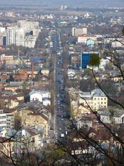 Street named Bohdana Khmelnytskoho in Lviv with buildings and clear blue sky