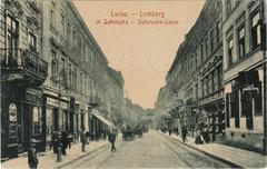 Street Sykstuska in Lviv with historic buildings and balcony advertising Węciel kamienny. Schnapek & Kandel