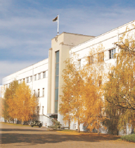 Front view of the main building of Akademija with clear blue sky