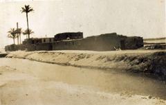 Pumping station in Helwan with industrial buildings and pumping equipment under blue sky