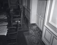 Broken glass and barricaded window-door inside Althingi after 1949 riots