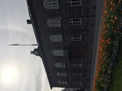 Iceland Althingi parliamentary building in 2016 surrounded by green landscape under blue sky