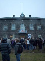 Alþingi parliamentary house in Reykjavík with protest signs about economic crisis
