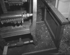 Broken glass on the floor next to a chair inside the Icelandic parliament in 1949