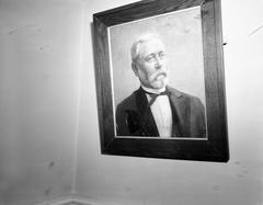 Interior of Althingi parliament with broken framed picture on the wall